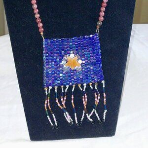 Amulet bag of hematite beads on a 26" necklace of jasper beads